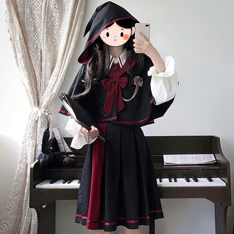 Ensemble trois pièces chemise à manches longues, jupe plissée, cape à capuche