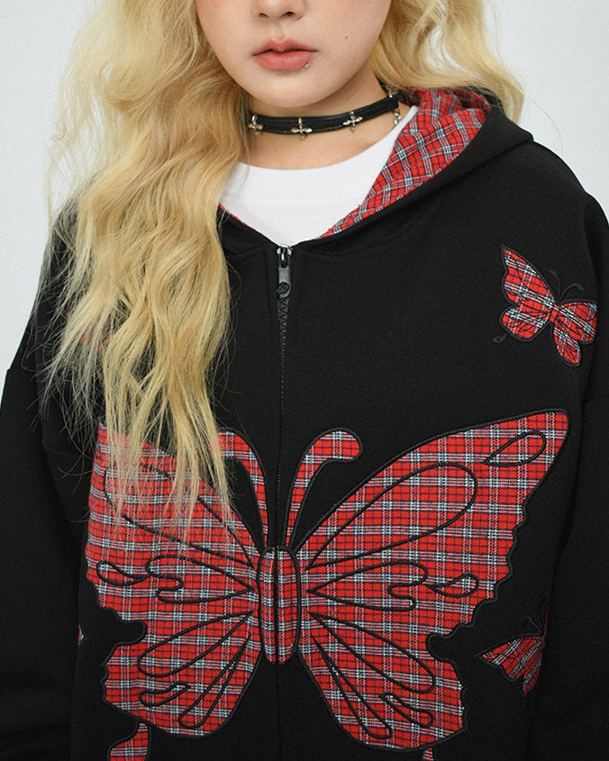 This 90's grunge hoodie features an oversized fit, plaid butterfly patches on the chest and sleeves, and a zip-up closure on the front. The hood is lined with red plaid fabric - boogzel clothing