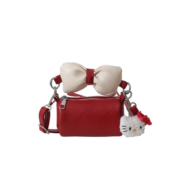 Bow Accent Cylinder Crossbody Bag