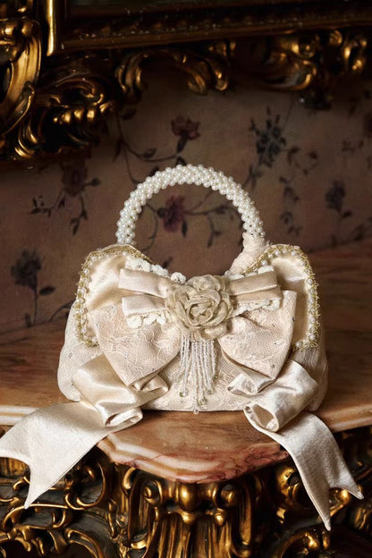 Gilded Pearl Bow Satin Handbag in Champagne
