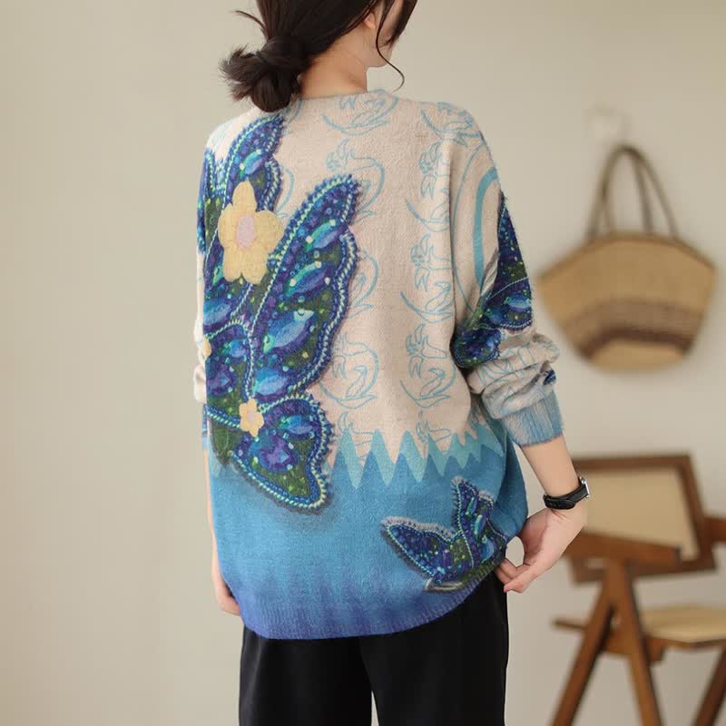 Pull vintage à imprimé papillon et fleurs bleues