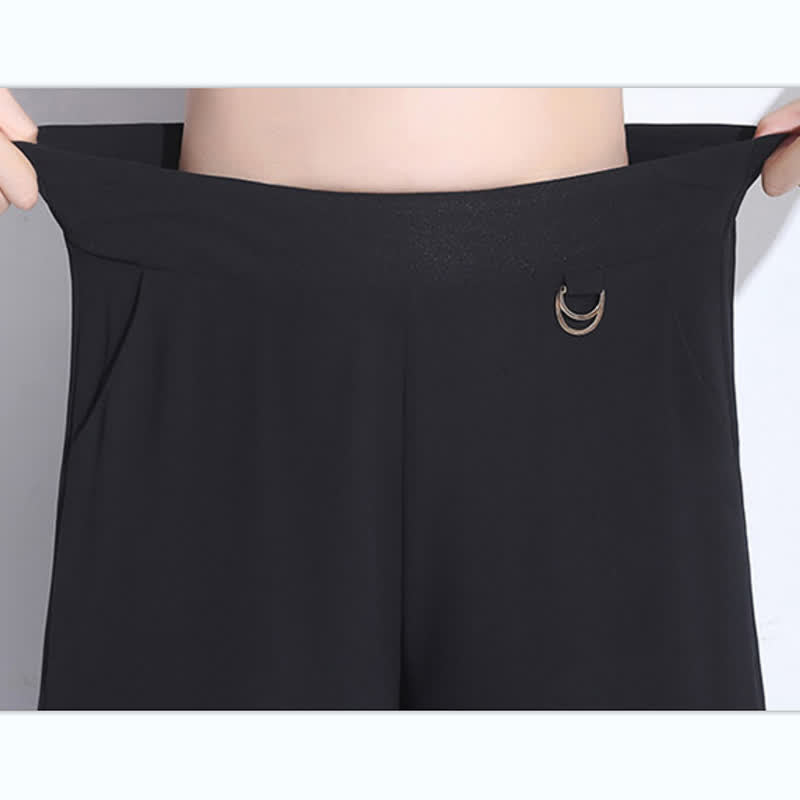 Elegante schwarze Hose mit weitem Bein und Spitzennähten