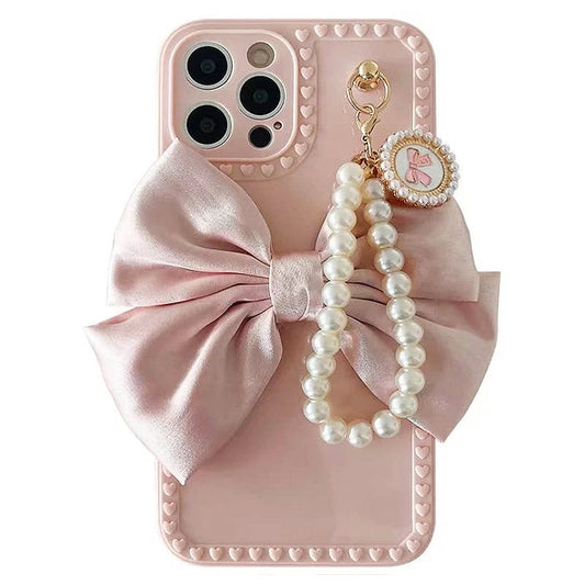 Coque de téléphone à motif de perles et nœud rose