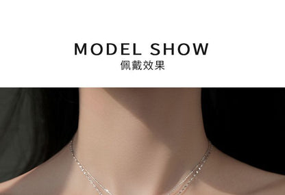 Mehrreihige Halskette aus Sterlingsilber mit Schmetterlingsanhänger