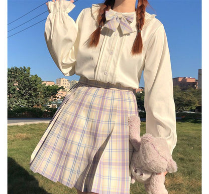 Chemisier à manches longues et bordure à volants