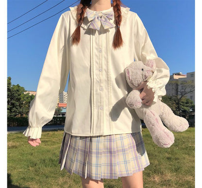 Chemisier à manches longues et bordure à volants