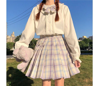 Chemisier à manches longues et bordure à volants