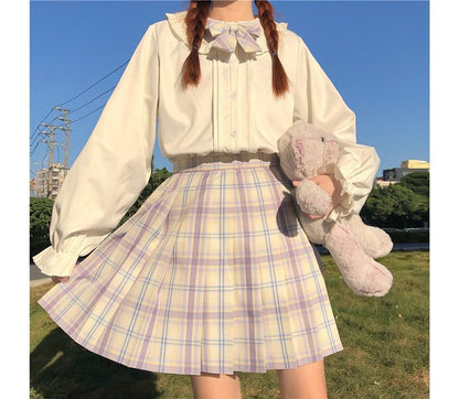 Chemisier à manches longues et bordure à volants