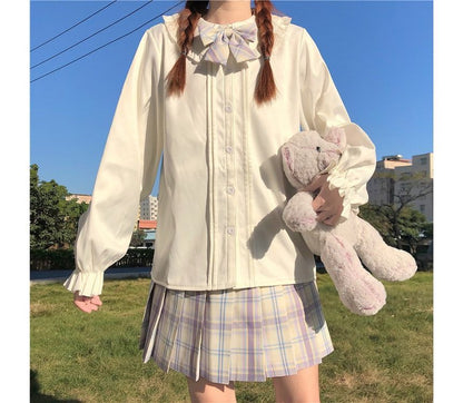 Chemisier à manches longues et bordure à volants