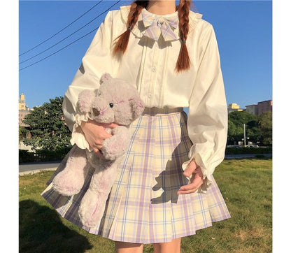 Chemisier à manches longues et bordure à volants