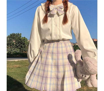 Chemisier à manches longues et bordure à volants