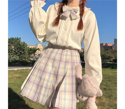 Chemisier à manches longues et bordure à volants