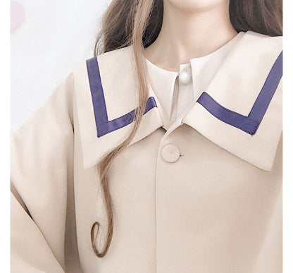 Cape mit Kontrastbesatz / Langärmliges, schlichtes Midikleid in A-Linie mit Kragen