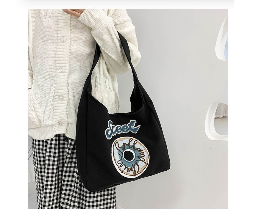 Schultertasche mit Donut-Stickerei