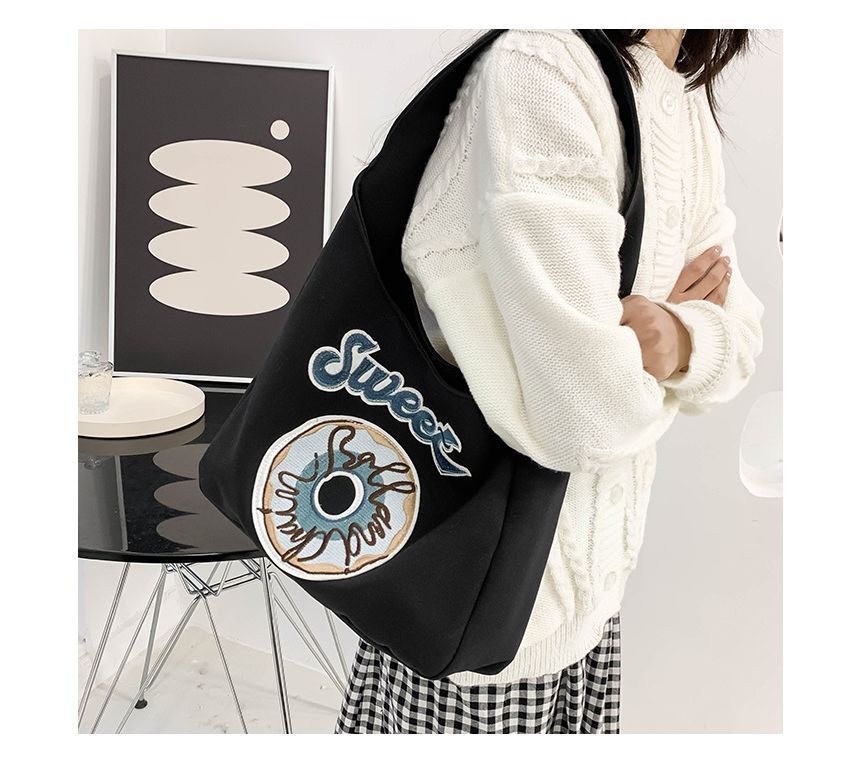 Schultertasche mit Donut-Stickerei