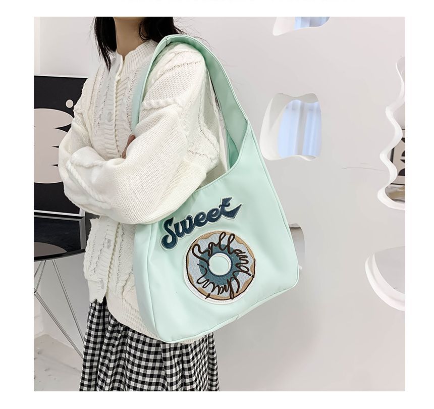 Schultertasche mit Donut-Stickerei