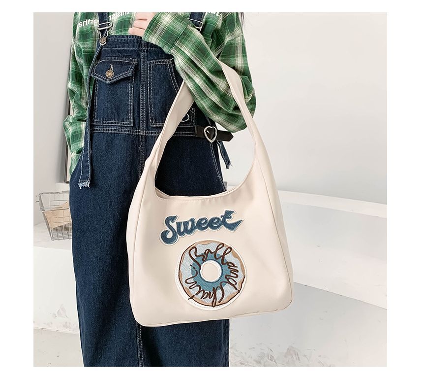 Schultertasche mit Donut-Stickerei