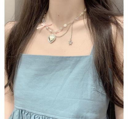 Halskette mit Kunstperlen und Herz-Anhänger