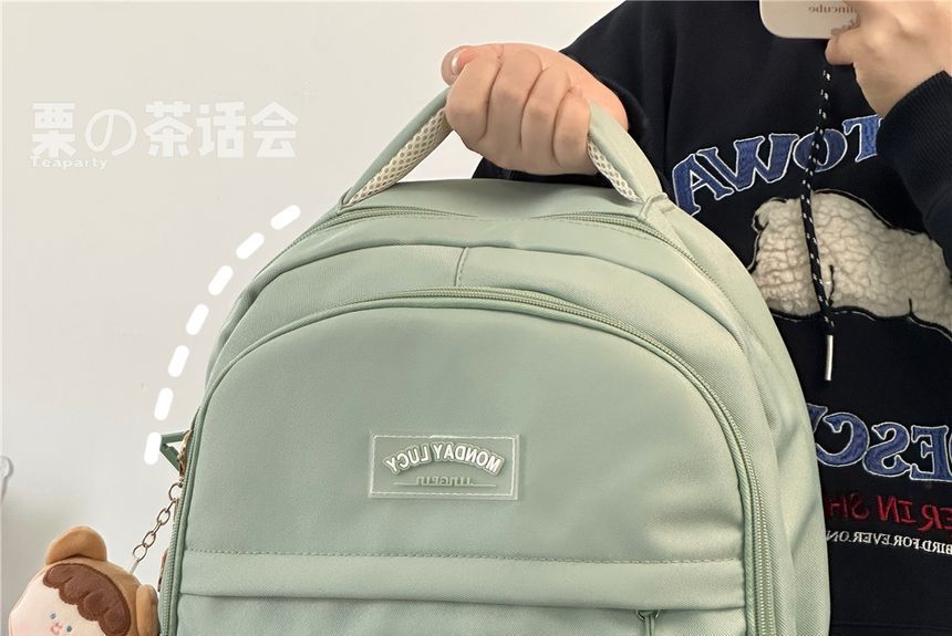 Lettering Label Buckled Flap Laptop Backpack