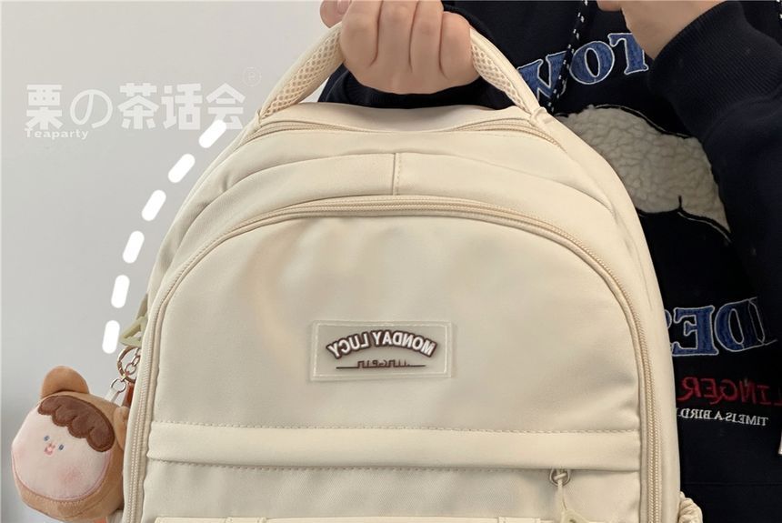 Lettering Label Buckled Flap Laptop Backpack