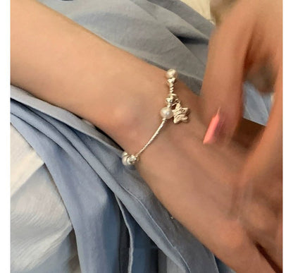 Armband mit Kunstperlen und Stern