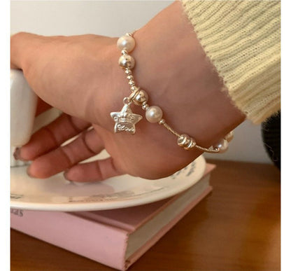 Armband mit Kunstperlen und Stern