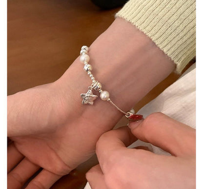 Armband mit Kunstperlen und Stern