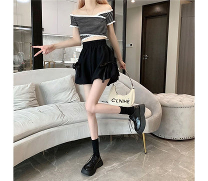 Short uni à taille élastique et nœud