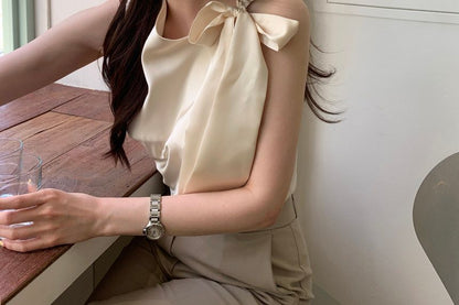 Sleeveless Asymmetrical Neck Plain Bow Blouse