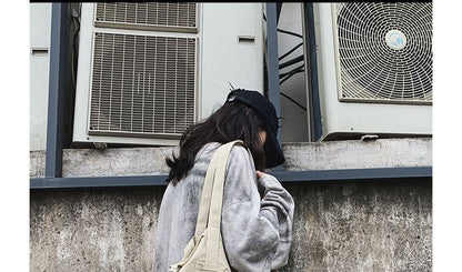 Sac bandoulière effiloché multi-poches