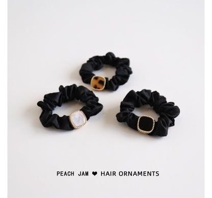 Élastique à cheveux avec bouton