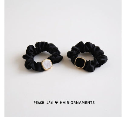 Élastique à cheveux avec bouton