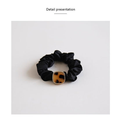 Élastique à cheveux avec bouton