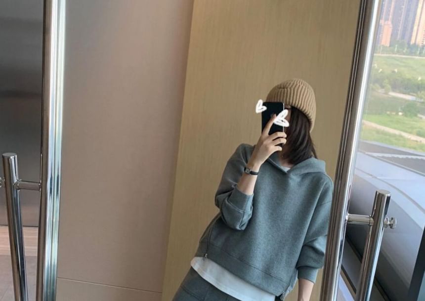 Long-Sleeve Hoodie Paired with High-Rise A-Line Skirt