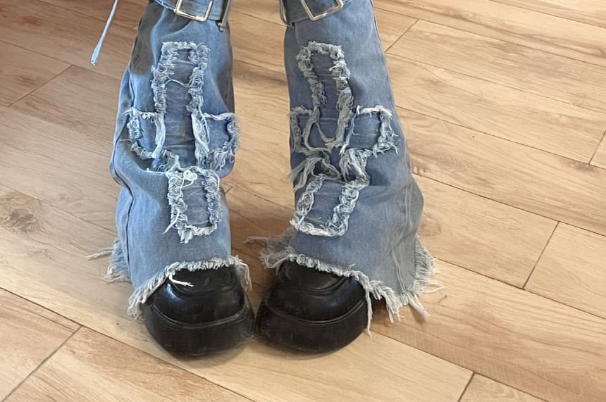 Jambières en denim à boucle et bordure à franges appliquées