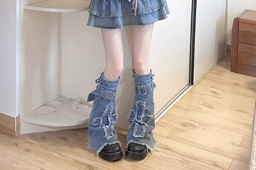 Jambières en denim à boucle et bordure à franges appliquées