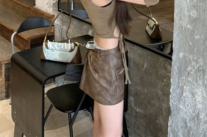 Sleeveless Round Neck Cutout Top / Mid Waist Faux Leather Mini Pencil Skirt