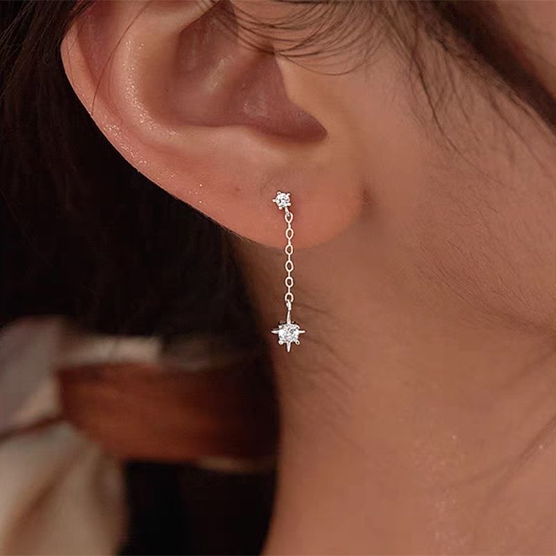 Boucle d'oreille pendante en alliage avec strass en forme d'étoile