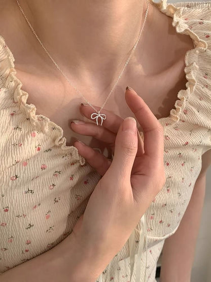 Halskette aus Legierung mit Schleife-Anhänger