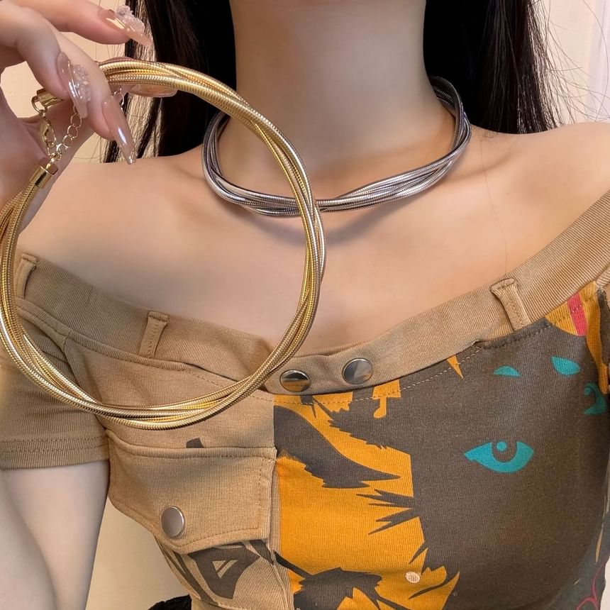 Layered Alloy Choker