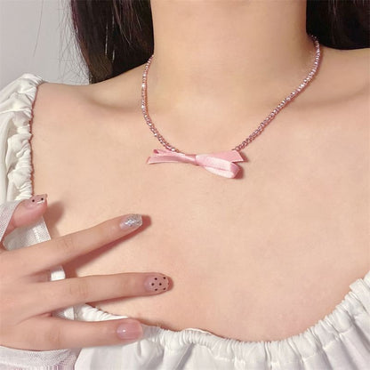 Beaded Necklace With Bow Pendant