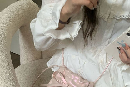 Sac à bandoulière avec cordon de serrage et nœud