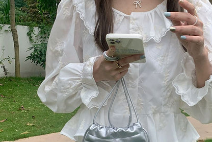 Sac à bandoulière avec cordon de serrage et nœud