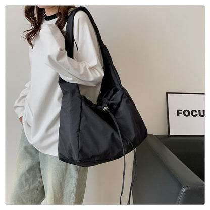 Sac bandoulière uni avec cordon de serrage