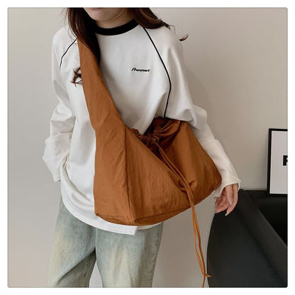Sac bandoulière uni avec cordon de serrage