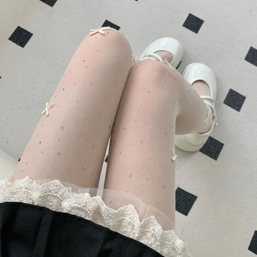 Collants transparents avec nœud et strass