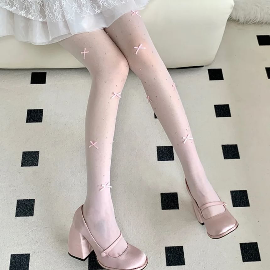 Collants transparents avec nœud et strass