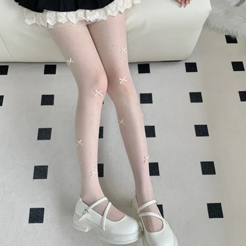 Collants transparents avec nœud et strass