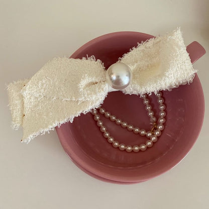 Pince à cheveux avec nœud en fausses perles