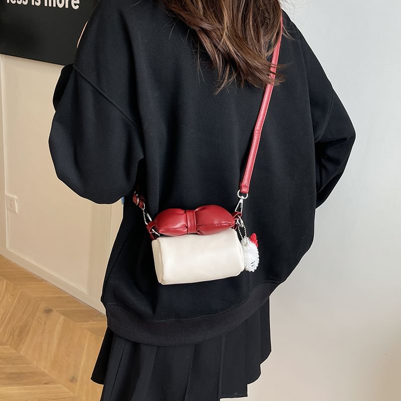 Bow Accent Cylinder Crossbody Bag